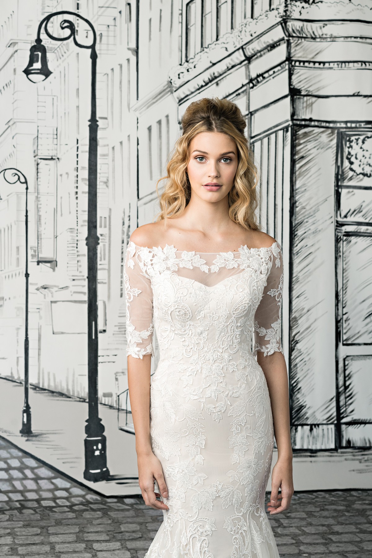 Ivy - Size 12 - Justin Alexander 8903, Off the shoulder lace Mermaid wedding dress with elbow length lace sleeves available at Blessings Bridal Boutique, Brighton, East Sussex, BN1 5GG. Telephone: 01273 505766
