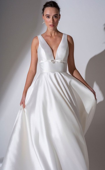 Freda Bennet Lennox - Elegant V neck Mikado wedding dress with straps and ball gown shape skirt with pockets. Modern bridal designs at Blessings Bridal shop Brighton. Loyal Parade, Mill Rise, Westdene, Brighton East Sussex. BN1 5GG T: 01273 505766 Email: info@blessingsbridal.co.uk