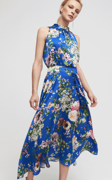 Luis Civit D809, Stunning sleeveless  Royal blue multi Floral print satin chiffon dress with high neckline & asymmetric hem. Blessings Bridal & Occasion Wear stockist Brighton, East Sussex. BN1 5GG Telephone: 01273 505766 Email: info@blessingsbridal.co.uk