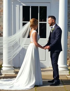 Tasha wore a beautiful chiffon dress with lace bodice and butterfly design back by Sincerity Bridal from Blessings Bridal 3 Loyal Parade, Mill Rise, Westdene, Brighton. BN1 5GG