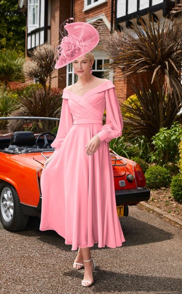 Veni Infantino 29677 - Coral Chiffon dress with Off the shoulder neckline & sleeves Mother of the Bride & groom dresses Now on Sale at Occasions at Blessings Loyal Parade, Mill Rise, Westdene, Brighton. BN1 5GG T: 01273 505766 E: info@blessingsbridal.co.uk