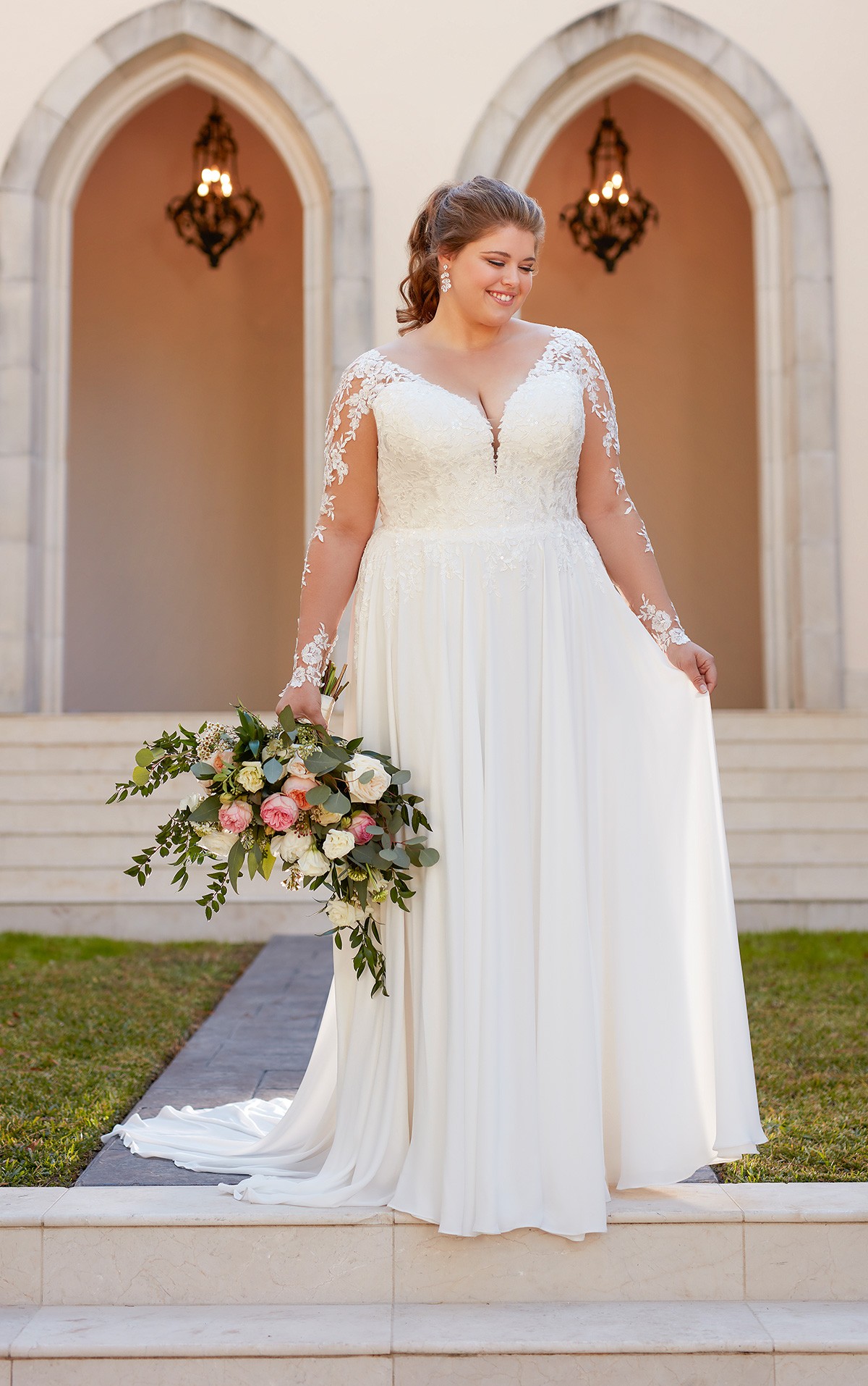 6843 - Alandra - Stella York 6843 Beautiful lightweight Satin/Chiffon dress with lace detail bodice and long Illusion lace sleeves. Plus size wedding dress at Blessings Bridal Shop, 3 Loyal Parade, Mill Rise, Westdene, Brighton. East Sussex. Bn1 5GG T:01273 505766 E:info@blessingsbridal.co.uk